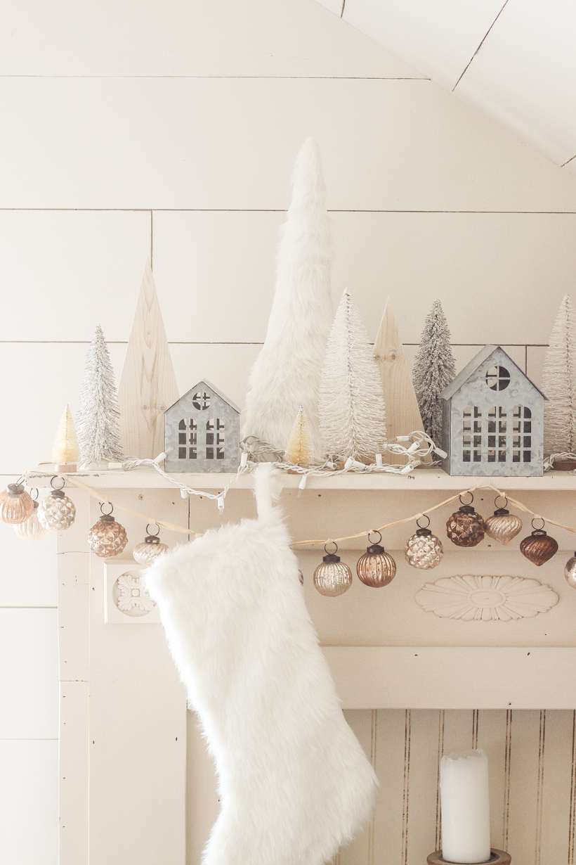 Interior decorator and home blogger Liz Fourez shares her beautiful mantel decorated for Christmas. Find out how you can build this exact mantel on LoveGrowsWild.com