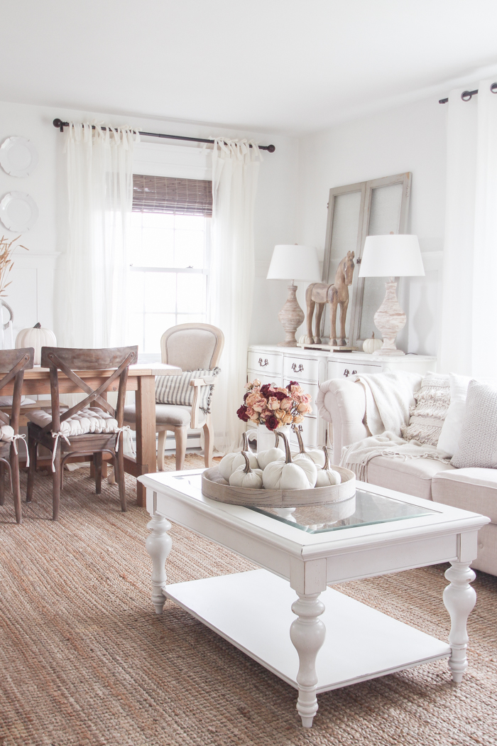 A beautiful farmhouse living room decorated with soft neutrals for fall