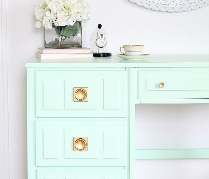 Come see how this old wood desk got a fun mint-colored makeover! Click for details at LoveGrowsWild.com