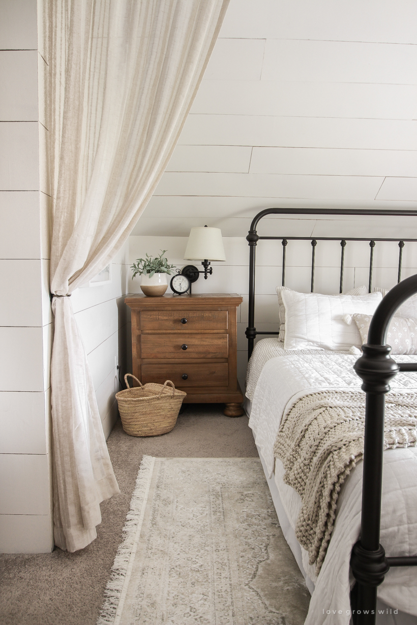 A new rug, curtains, bedding and artwork in designer Liz Fourez's beautifully cozy master bedroom