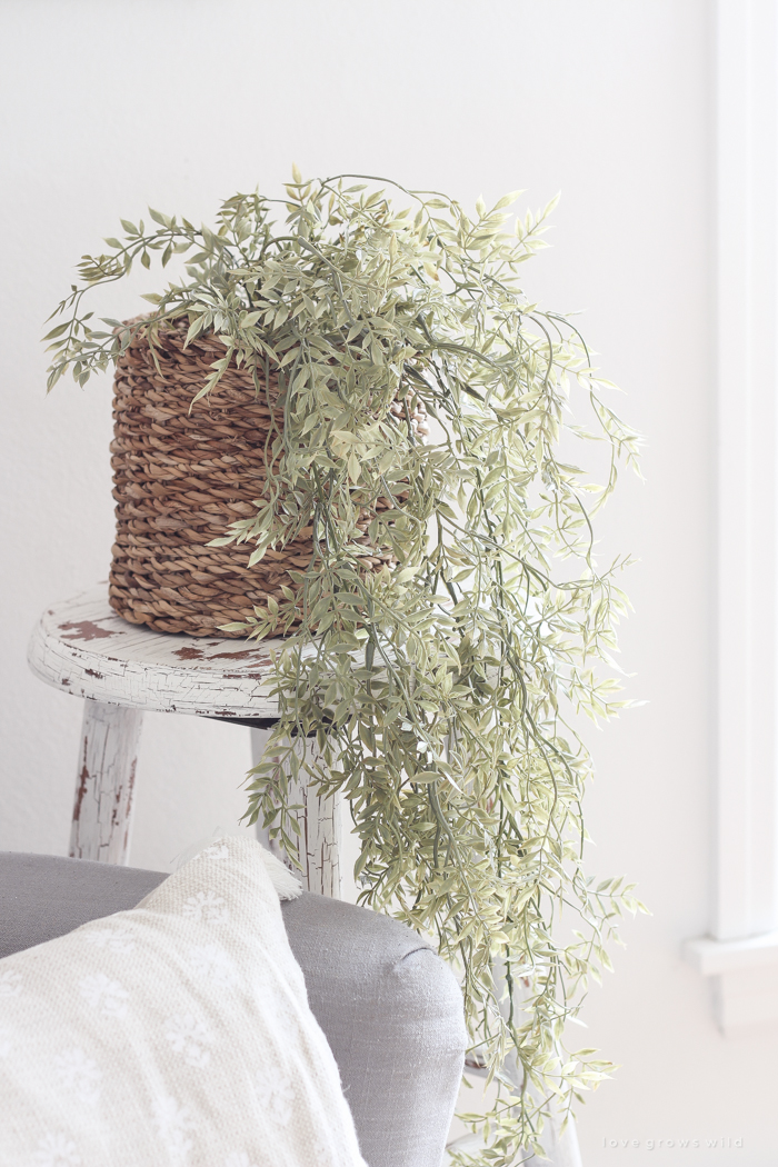 A lovely casual home office with lots of light, soft textures, and gorgeous greenery. 